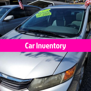 Silver sedan at a car lot with a bright pink “Car Inventory” banner across the windshield