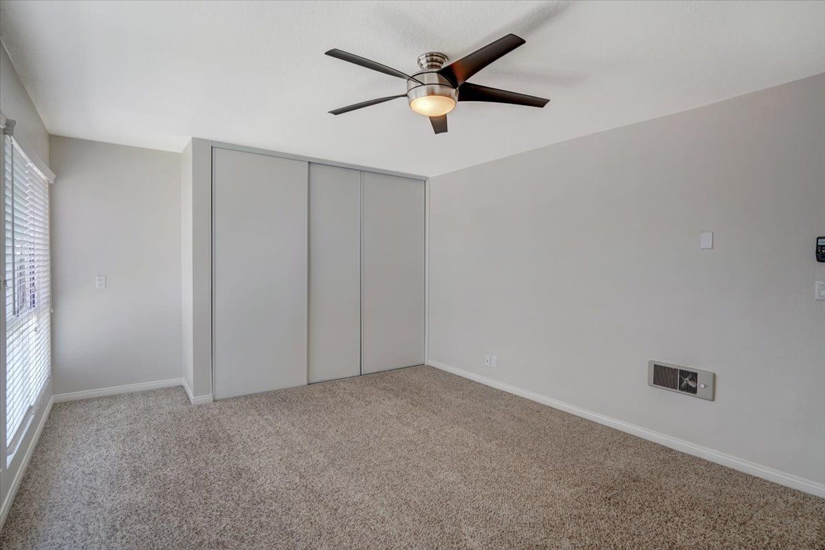 Avignon building interior bedroom closet and fan