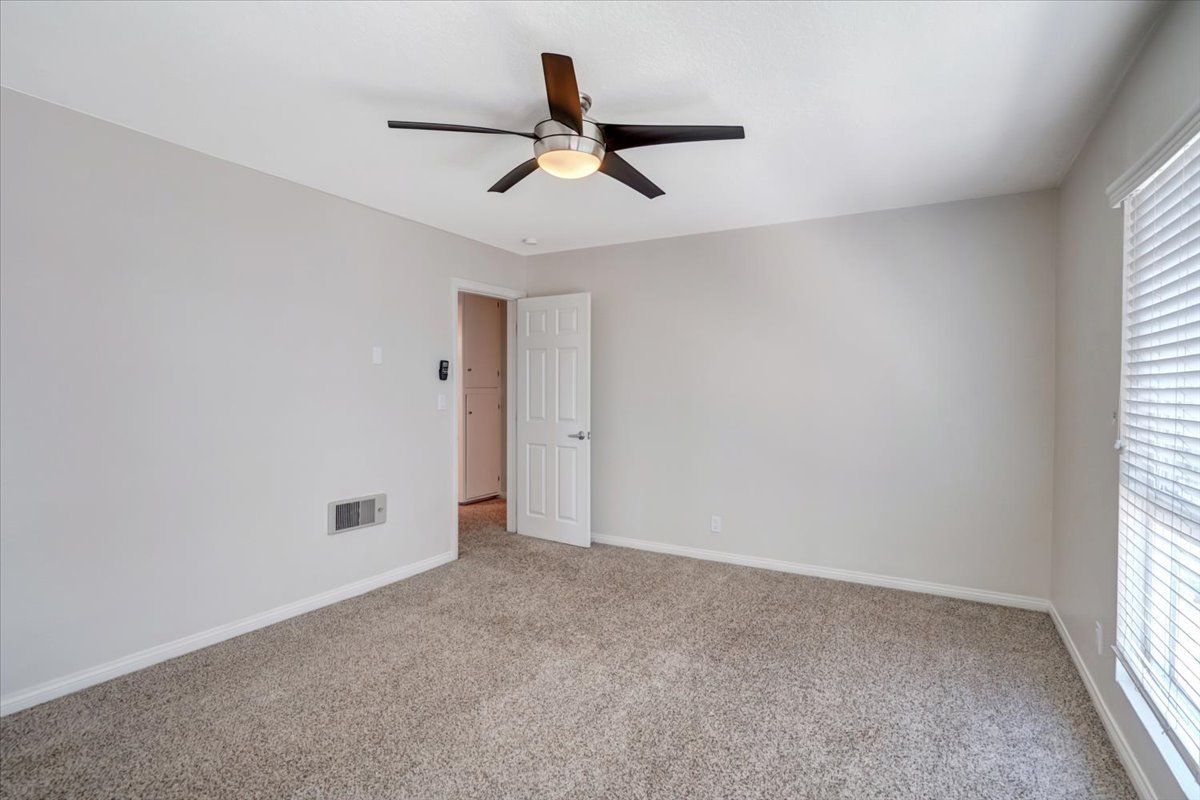 Avignon building interior bedroom door and fan