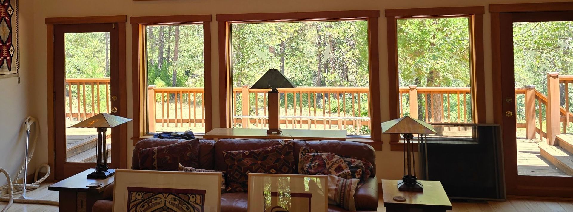 A living room with a lot of windows and a couch