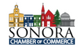 The logo for the sonora chamber of commerce shows a city skyline with buildings and trees.