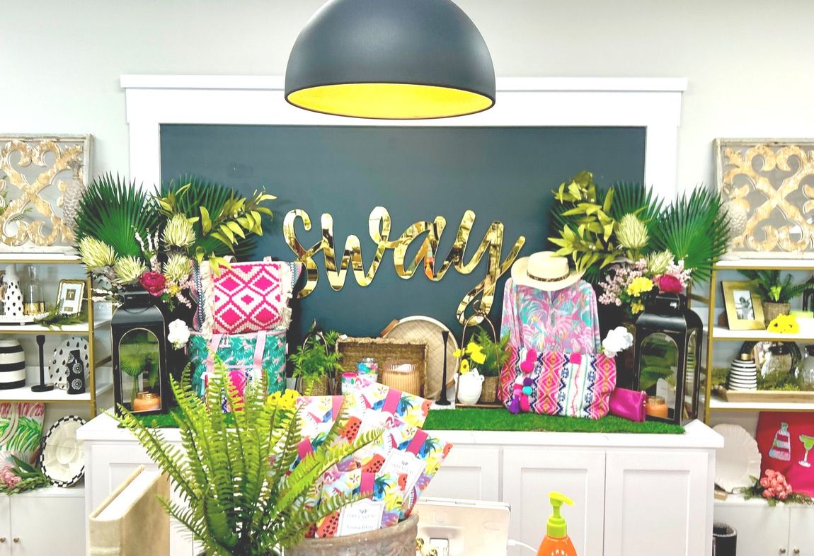 A room filled with lots of colorful decorations and a sign that says ' sally ' on it.