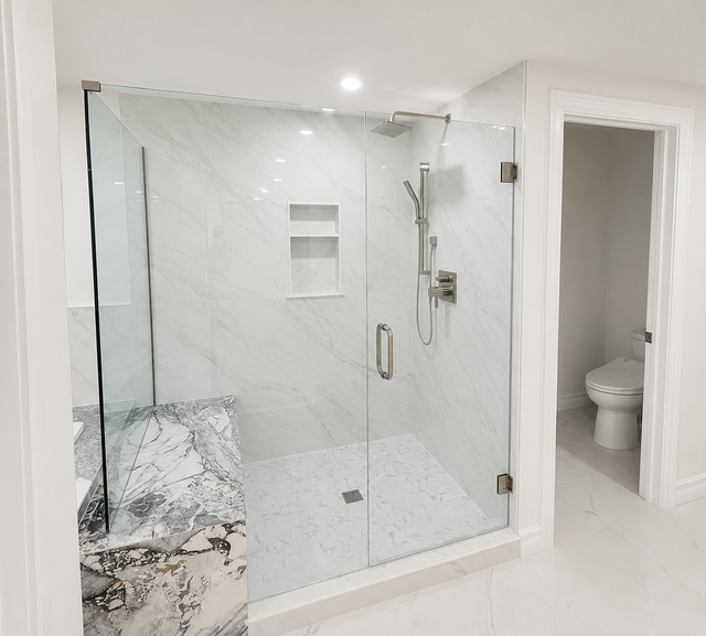 Bright white bathroom with a glass walk-in shower and adjoining toilet room