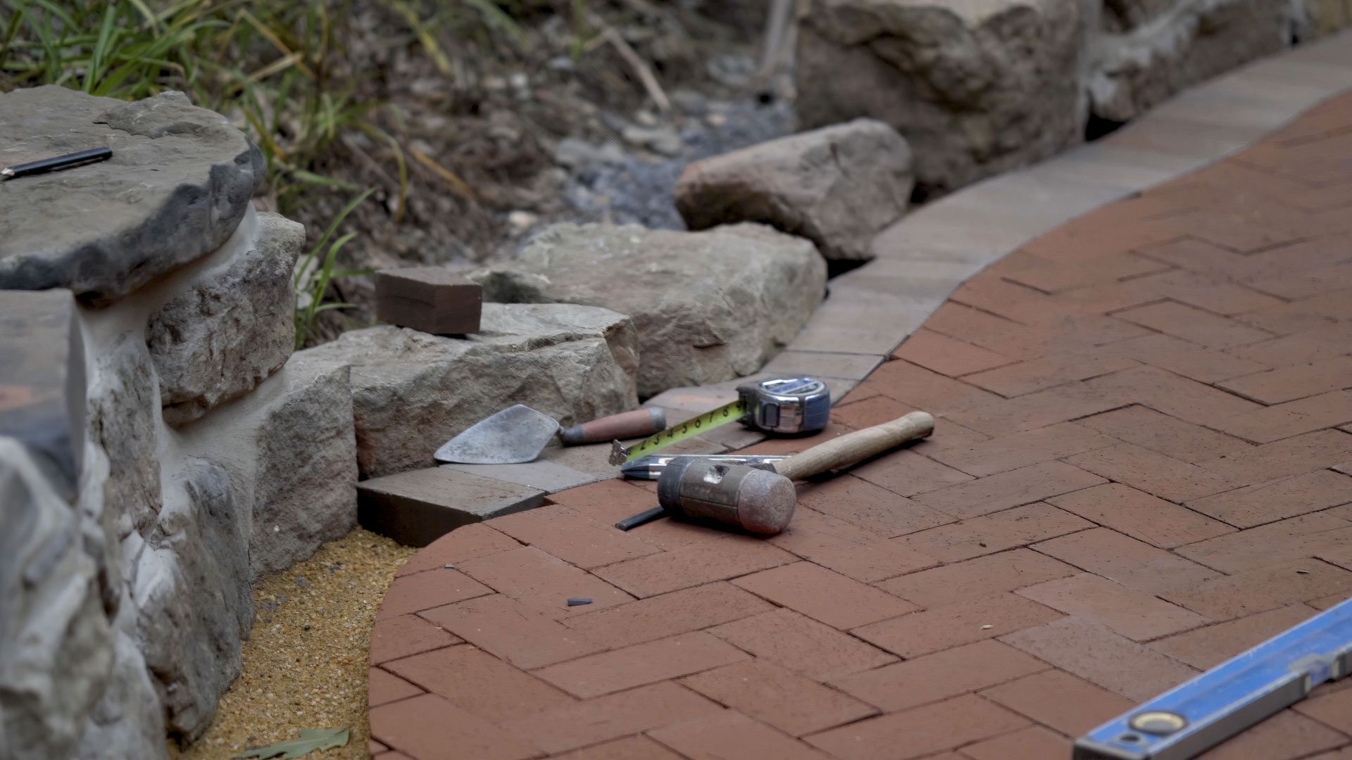 Tools, including a mallet and tape measure.