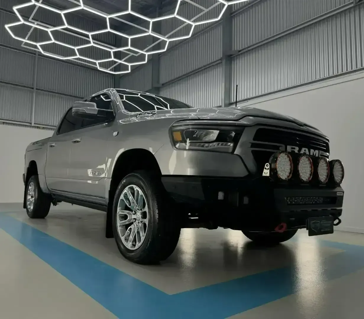 A Silver Ram Truck is Parked in a Showroom — Bathurst Detailing Studio in Bathurst, NSW