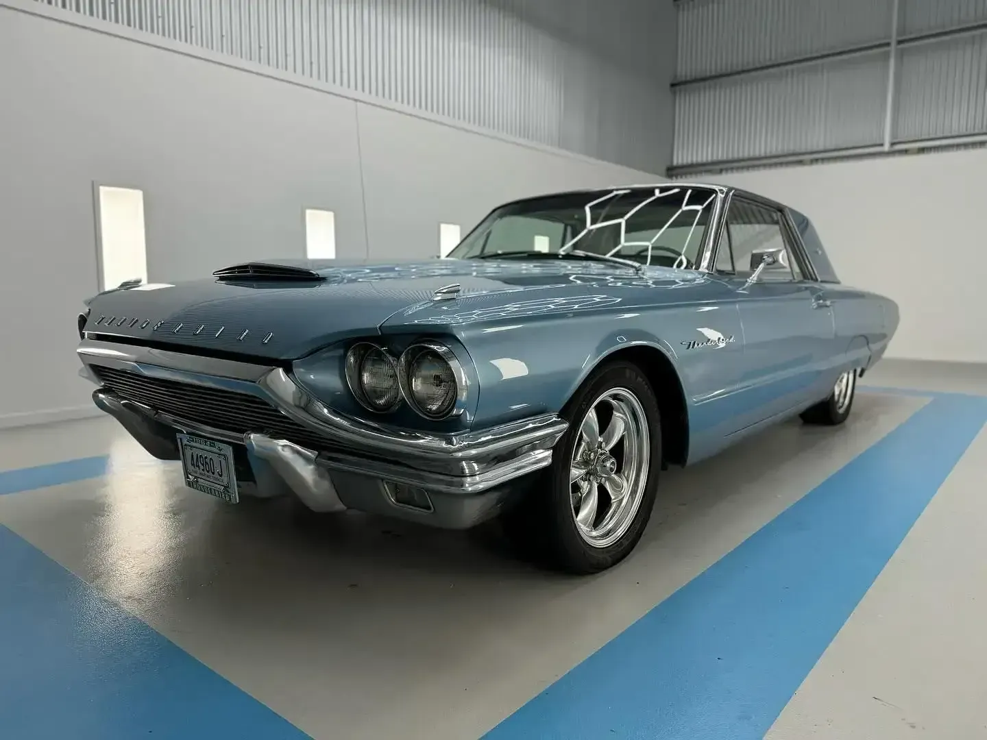 A Light blue Mustang is Parked in a Garage — Bathurst Detailing Studio in Bathurst, NSW
