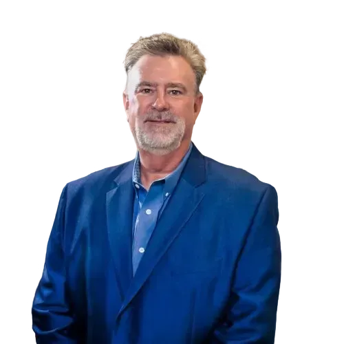 Man in a blue blazer and shirt posing against a white background