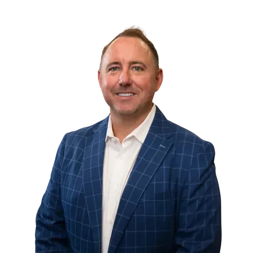 Man in a blue plaid blazer and white shirt, smiling against a white background