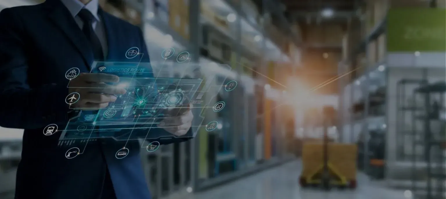 Businessman using a digital interface in an industrial warehouse corridor