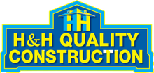 A blue sign that says h & h quality construction