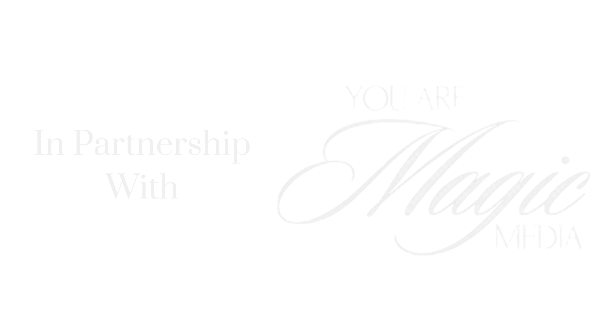 A white background with the words `` in partnership with magic '' written on it.
