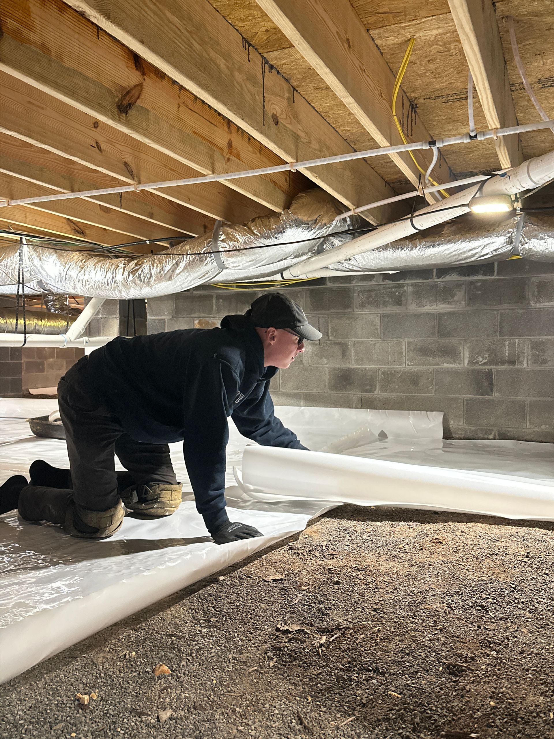 Foametix technician inspecting a crawl space in Chattanooga, TN