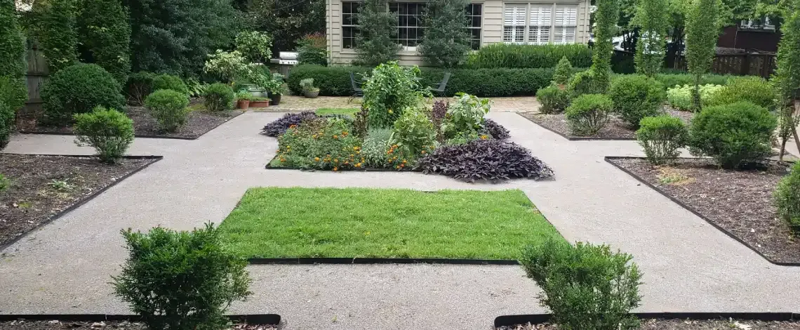Spring landscape cleanup removing debris and preparing planting areas in Lexington KY