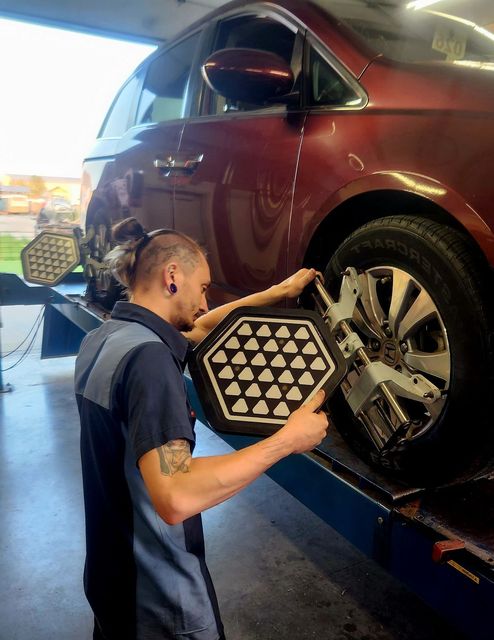 Mechanic working on Brake Disc | The KAR Shop