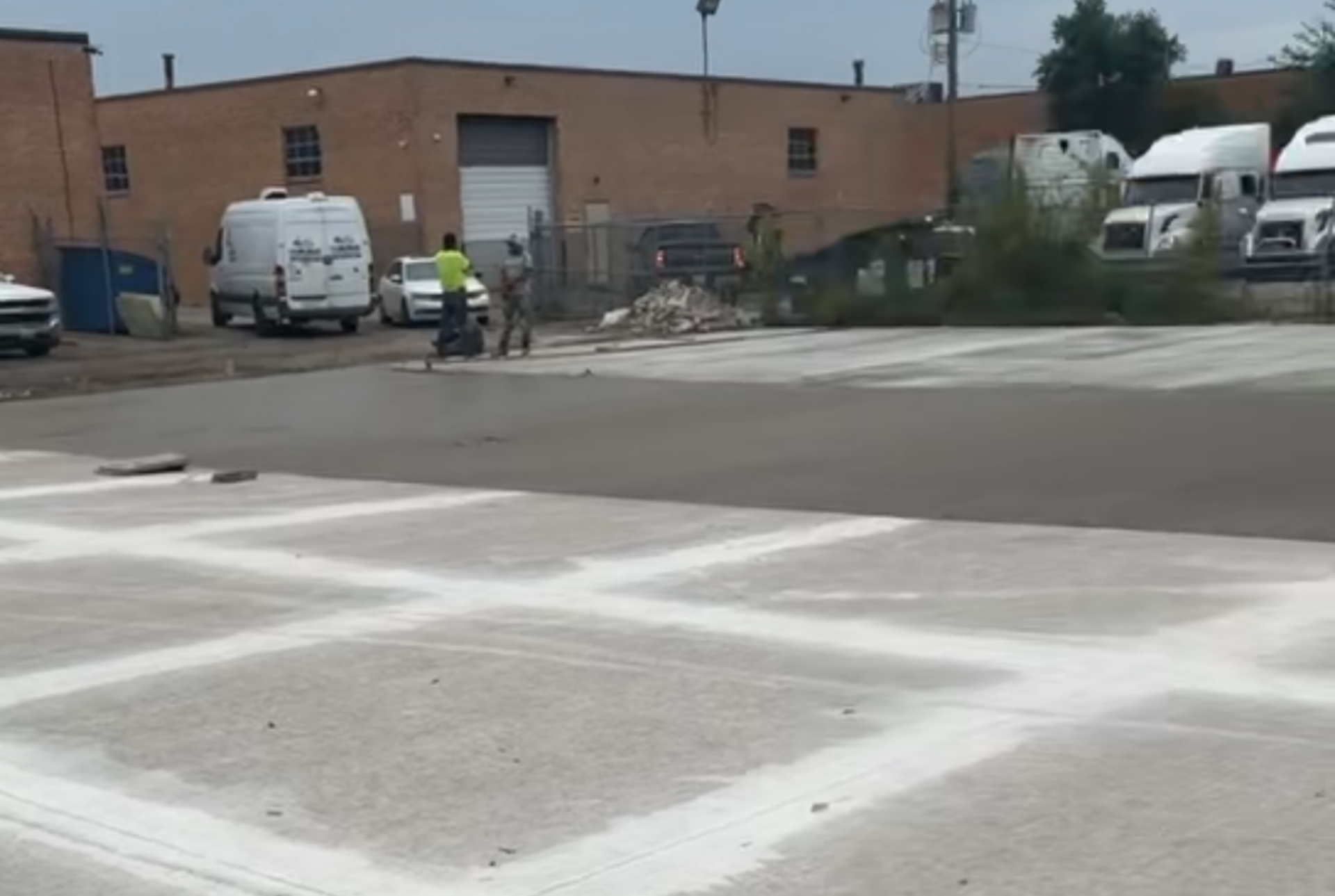 Freshly poured commercial concrete parking area with crisp expansion joints