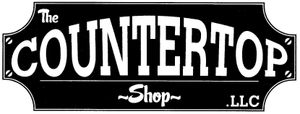 A black and white sign for the A black and white sign for the The Countertop Shop