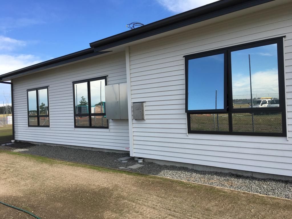 A white house with black windows - Christchurch, NZ - Tint A Window