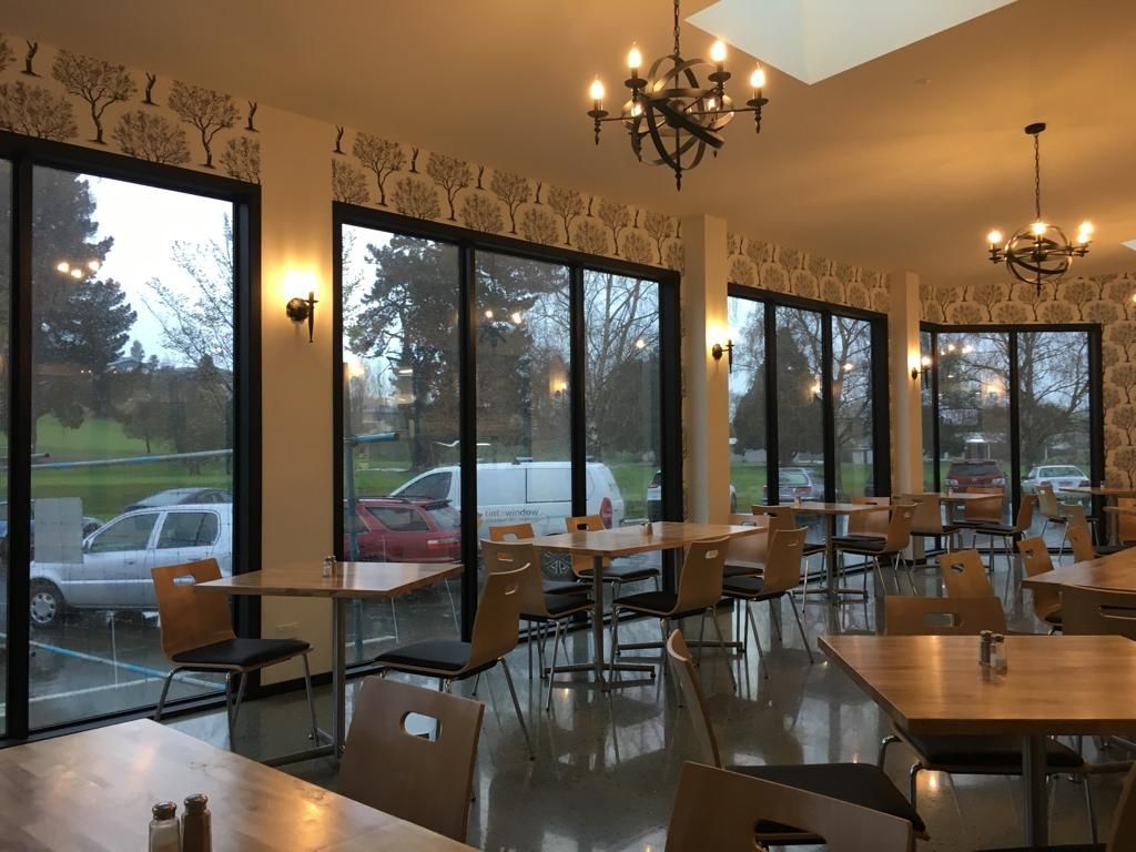 Inside a restaurant with tables and chairs - Christchurch, NZ - Tint A Window