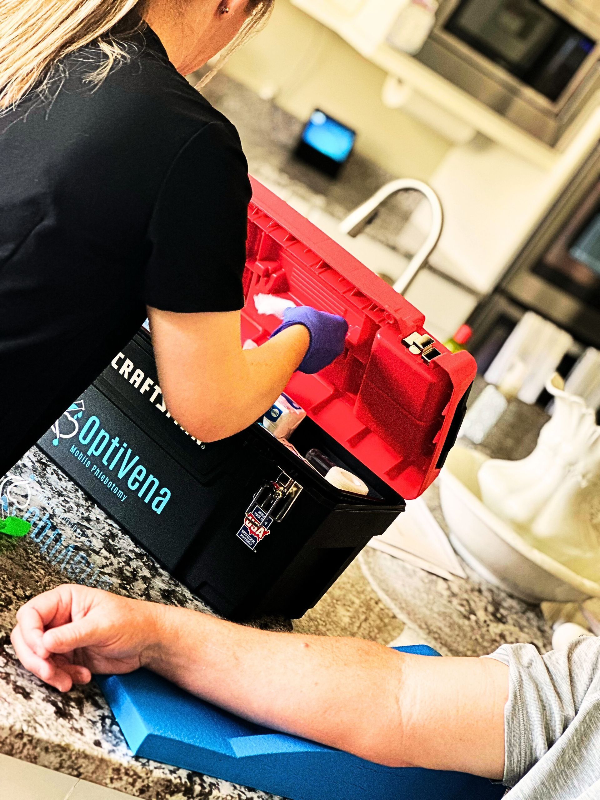 An OptiVena mobile phlebotomist performing an at-home lab draw for a patient in the Phoenix Valley