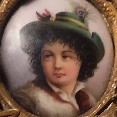 Portrait miniature of a person with dark curls in a feathered hat, wearing a white collar and red garment