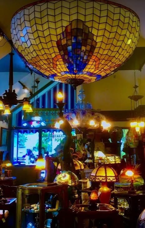Colorful indoor market display with glowing lamps and a large mosaic hot air balloon overhead
