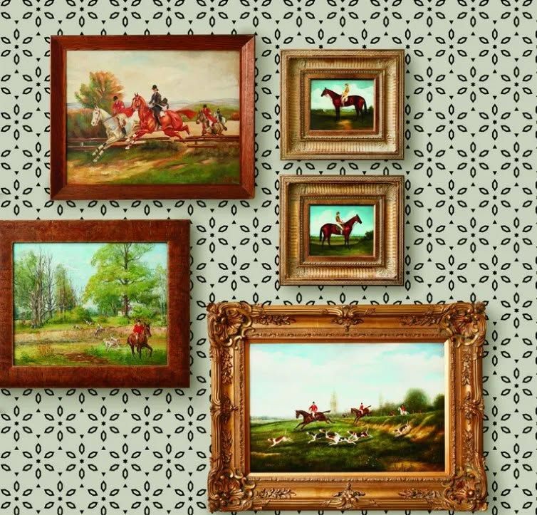 Cluster of framed paintings on patterned wallpaper, including horses, a rider, and pastoral landscapes.