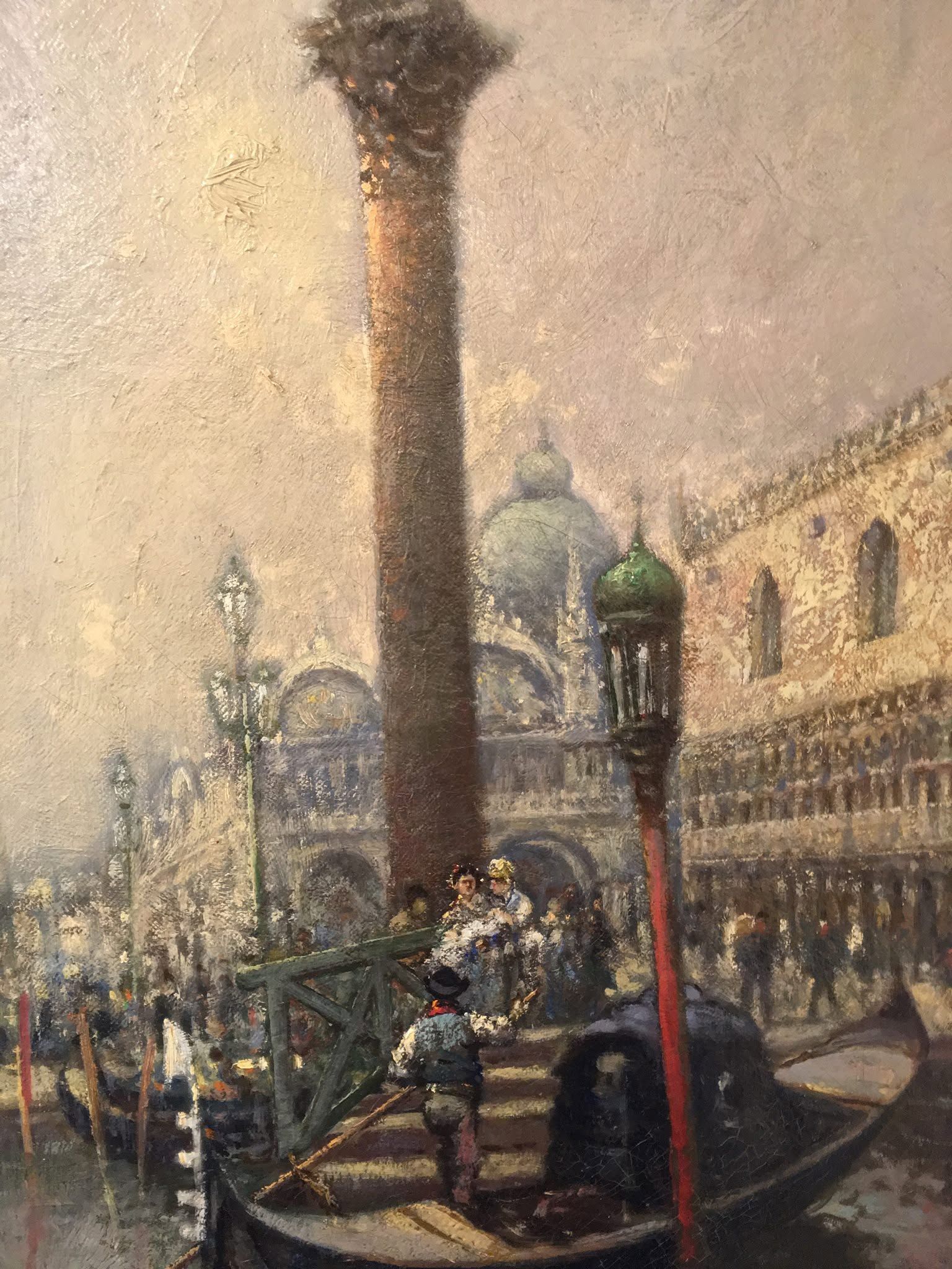 Venice canal scene with gondola, tall column, and ornate buildings in misty light