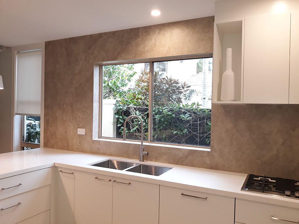 A Kitchen With Two Sinks And A Large Window — Cut N Edge Panel Factory In Coolum Beach, QLD