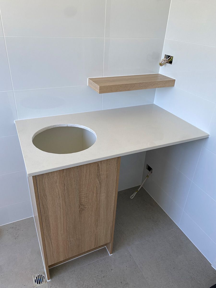 A Bathroom Counter With A Sink And A Shelf Above It — Cut N Edge Panel Factory In Coolum Beach, QLD