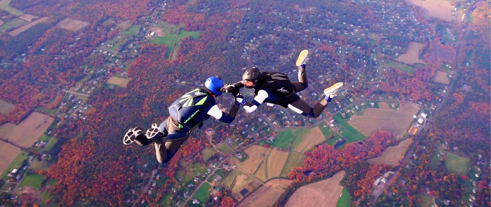 A couple of people are flying through the air.