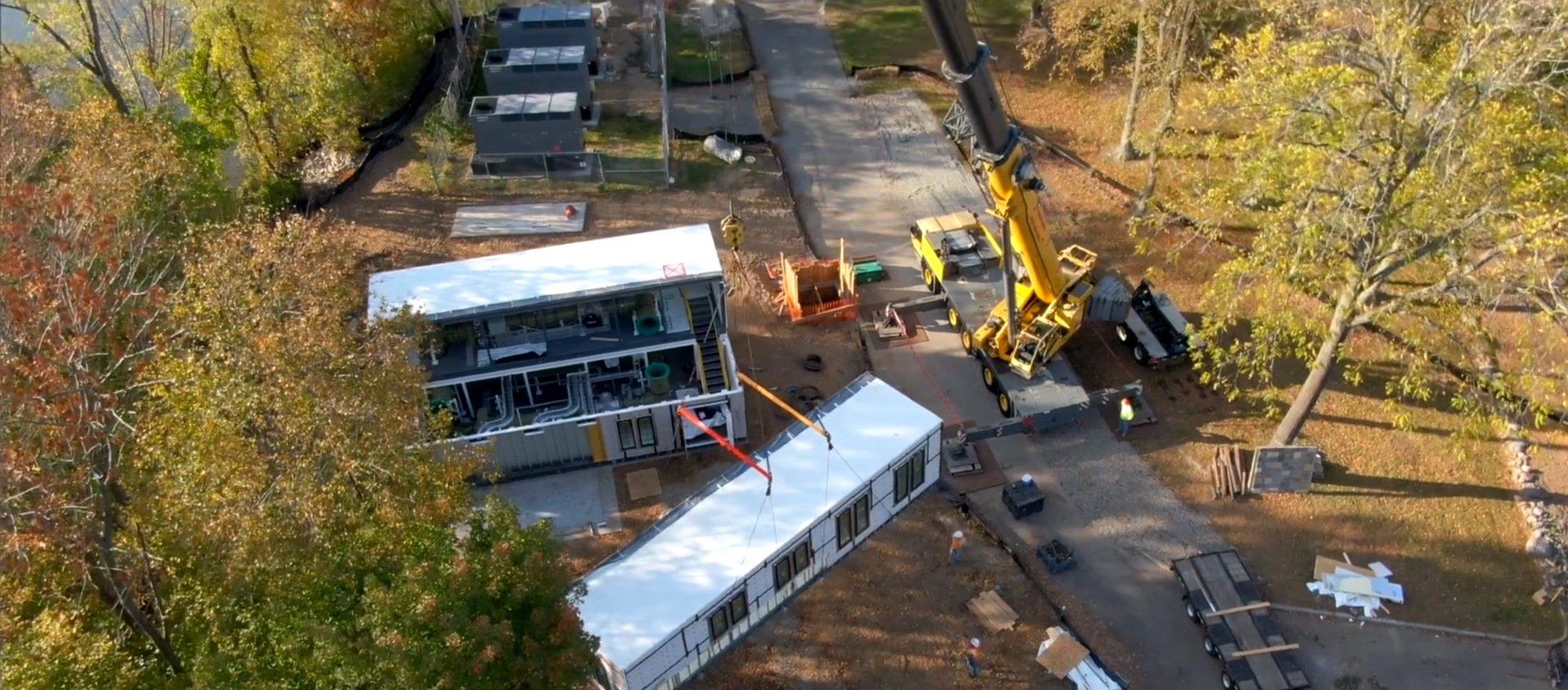 An aerial view of a building being built in a park.
