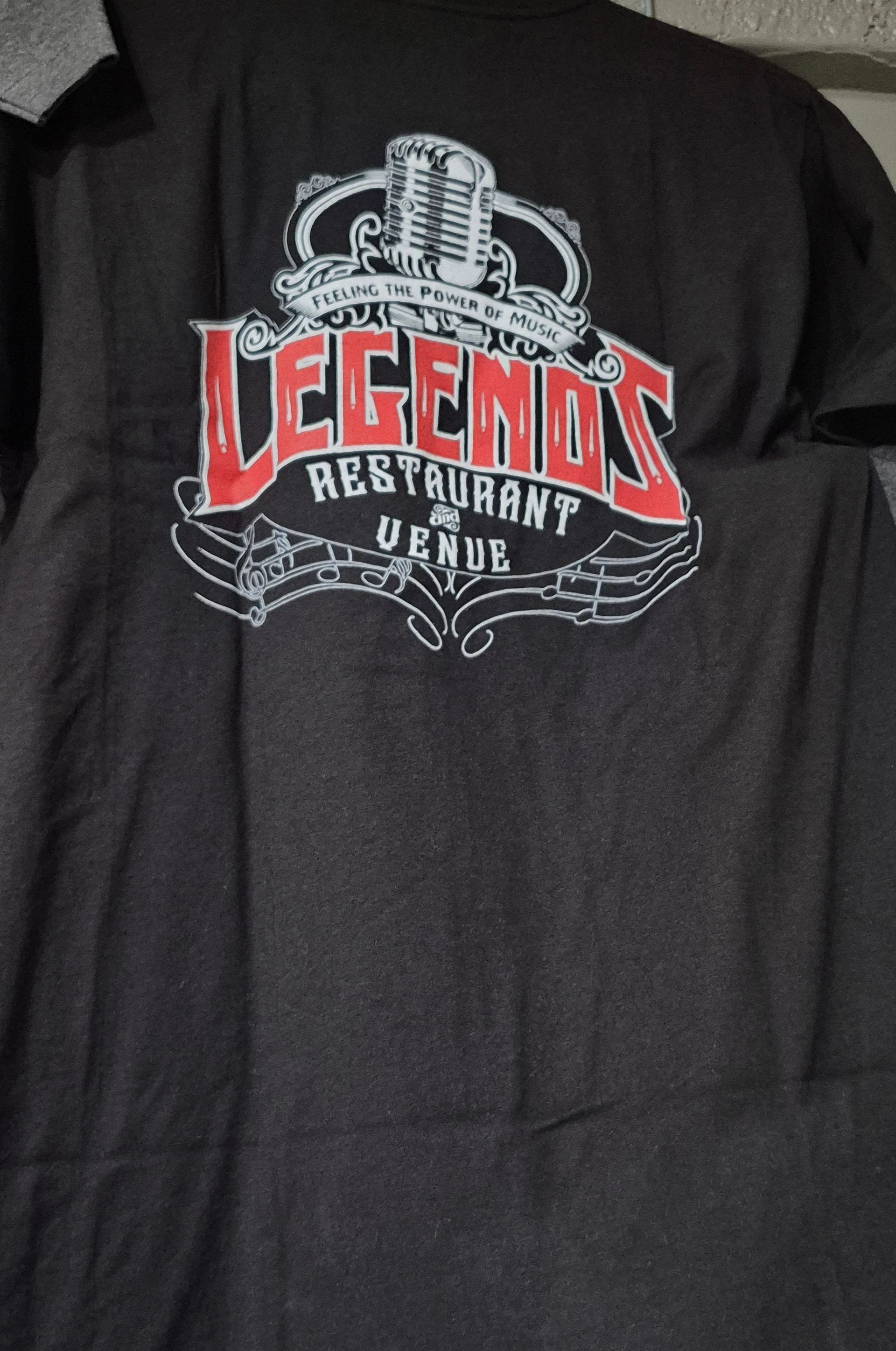 Black T-shirt with a red and white “LEGENDS” graphic and crown design on the chest