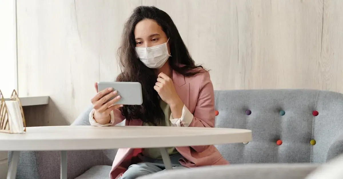 Women wearing a mask while having a telehealth appointment with her doctor