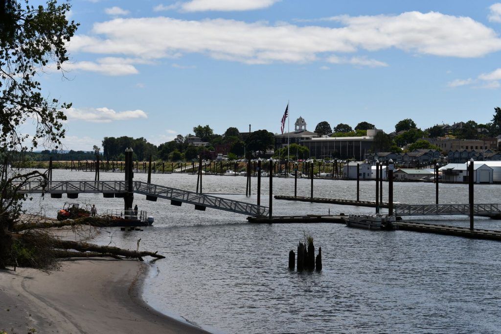A large body of water with a dock in the background