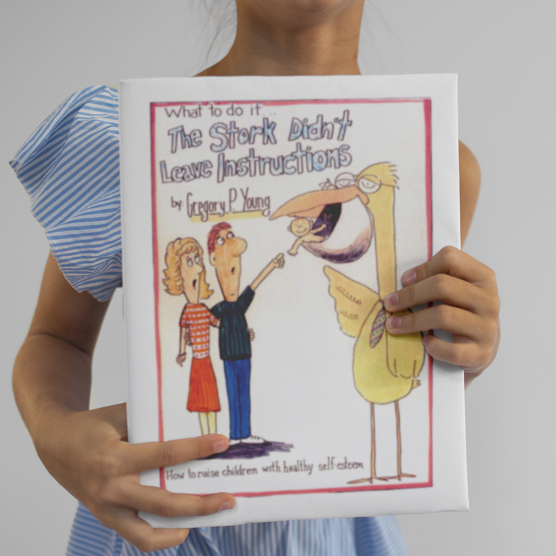 Person holding a children’s book cover titled “The Shock of Love” with a cartoon man, woman, and child.