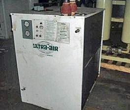 A white box with a green logo on it is sitting on the floor in a room.