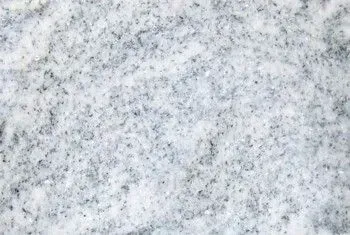 Close-up of light gray speckled stone surface