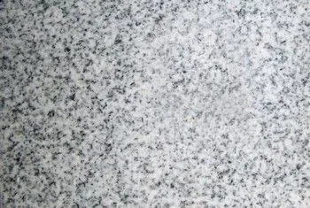 Gray speckled granite or stone surface texture