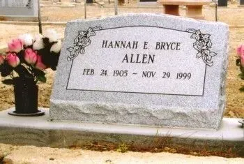 Gravestone for Hannah E. Bryce Allen with flowers beside it