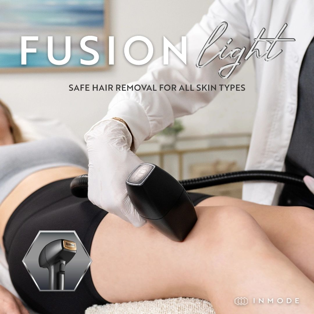A woman is getting a hair removal treatment on her leg.