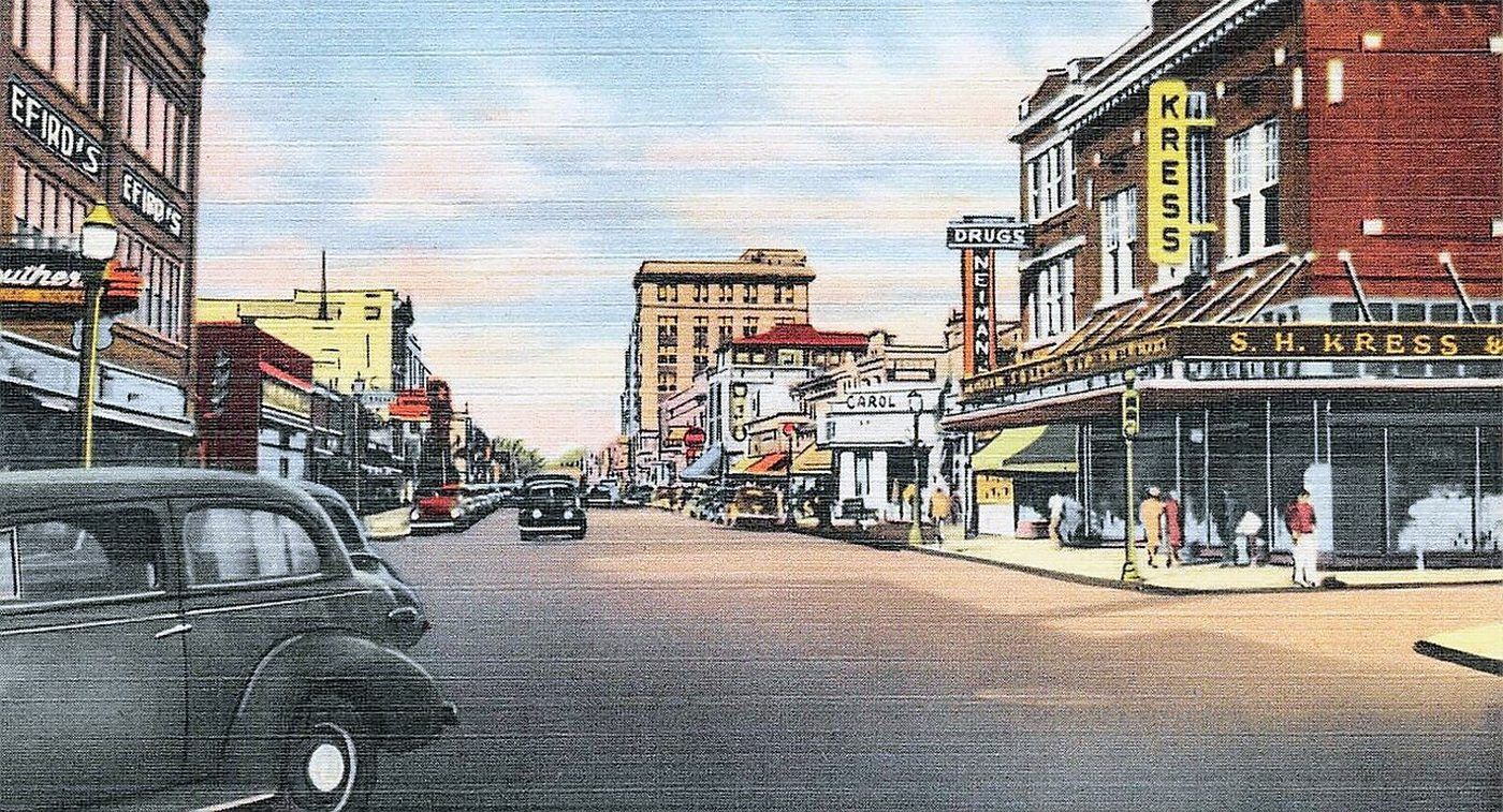 A 1948 postcard of Main Street in Sumter, with period storefront signs along both sides
