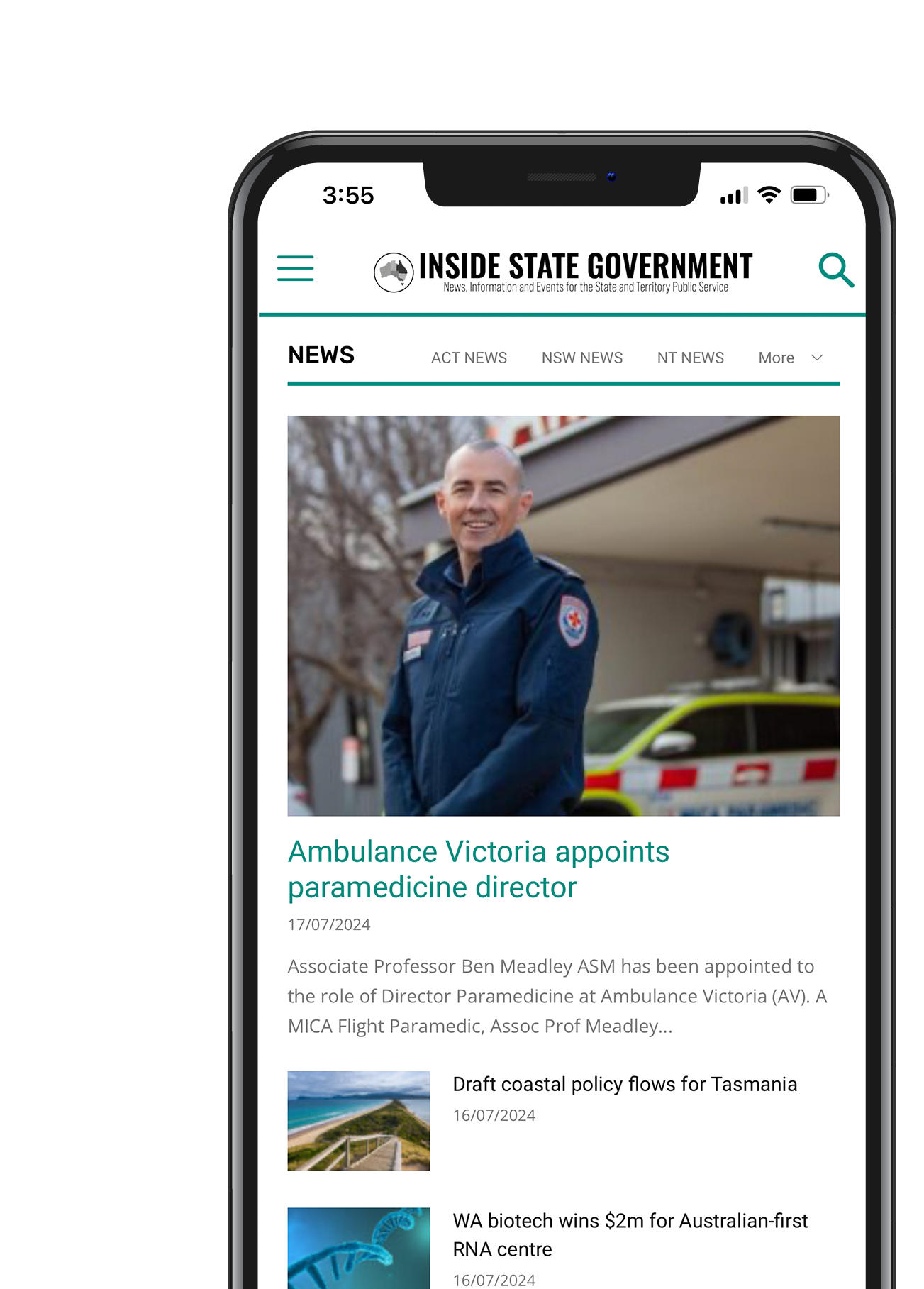 A man is standing in front of an ambulance on a cell phone.