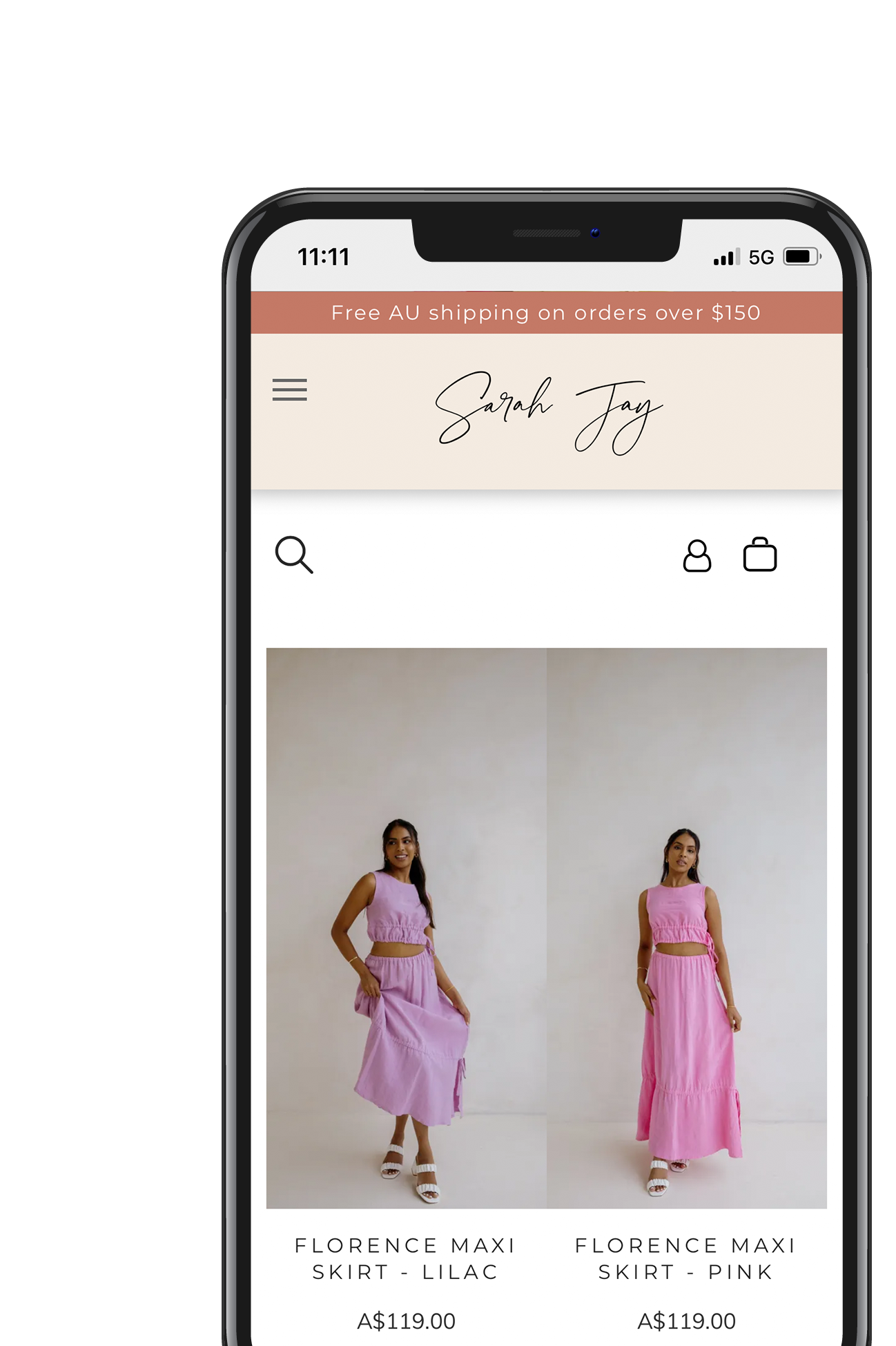 A cell phone with a picture of a woman in a pink dress on the screen.