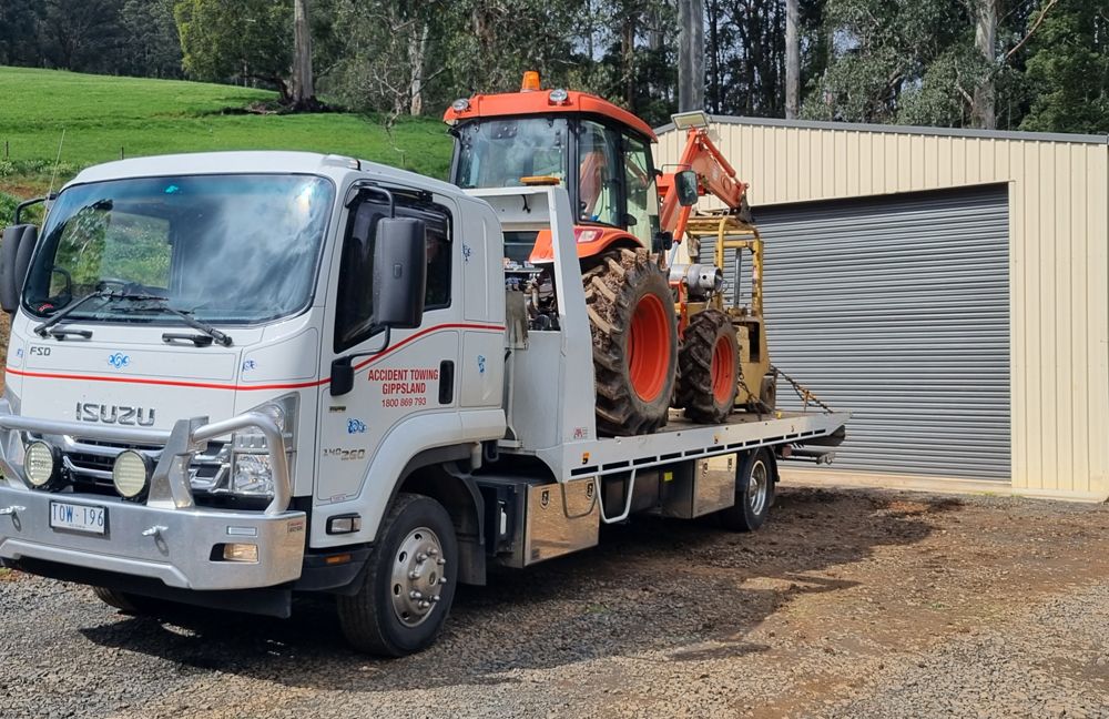 Tractor on Trailer Truck — Warragul, VIC — Accident Towing Gippsland Tractor on Trailer Truck — Warragul, VIC — Accident Towing Gippsland