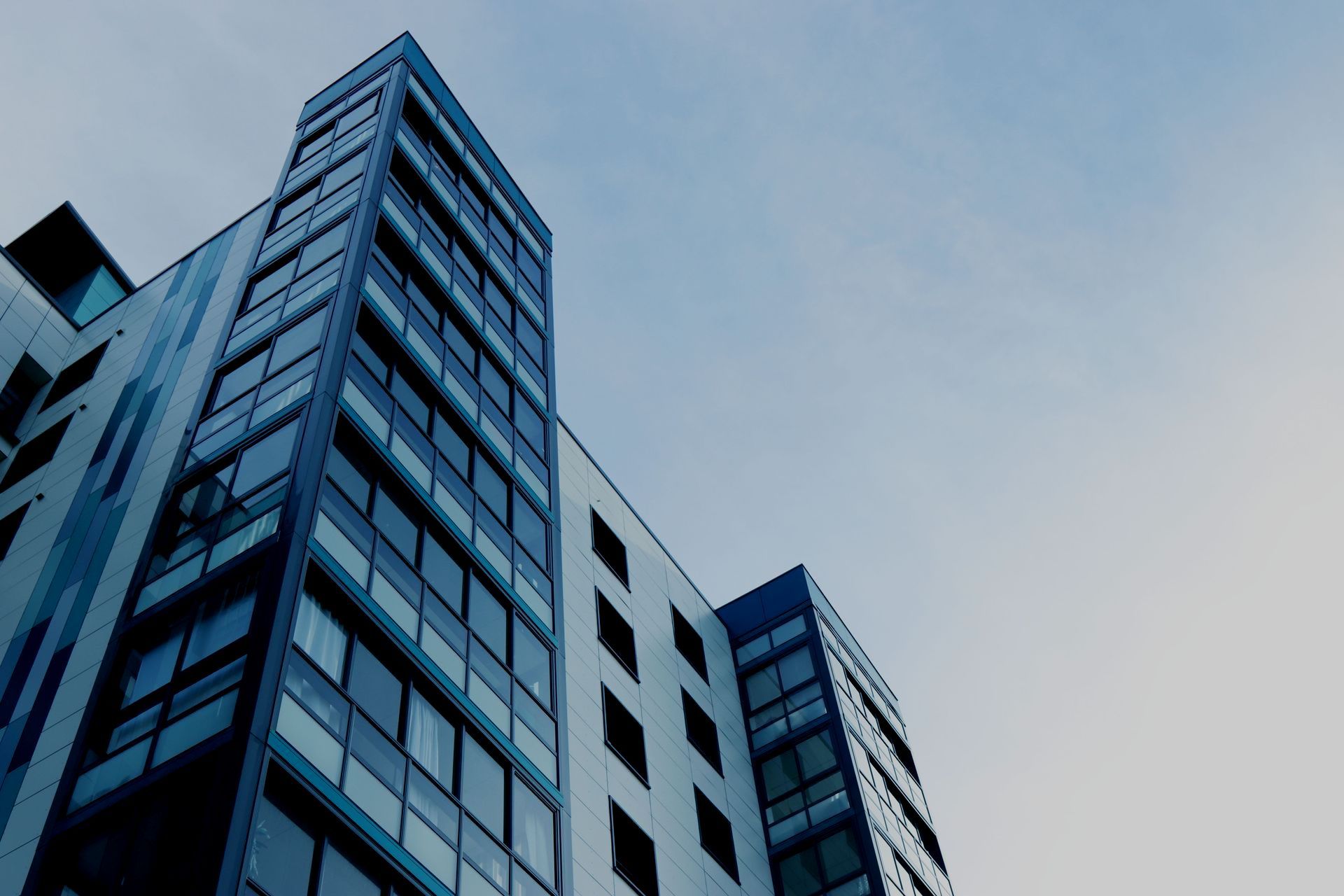 Skyrise building representing Multi-Family Development by Curco Capital.