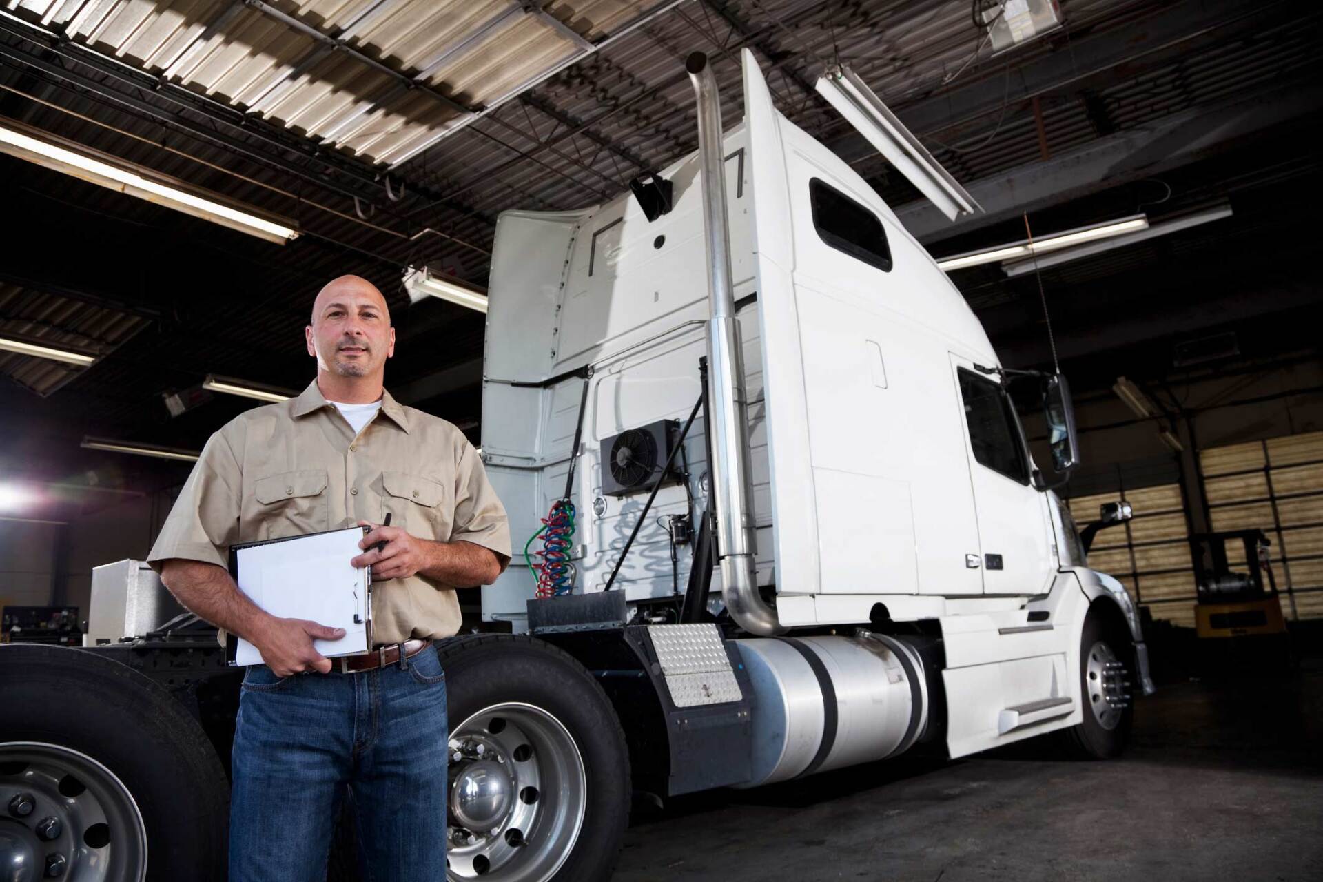 Man standing next to white truck — Gary, IN — Macer Transportation Man standing next to white truck — Gary, IN — Macer Transportation