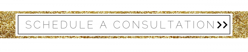 Gold banner with the words “Schedule a Consultation” and double-chevron arrows on the right