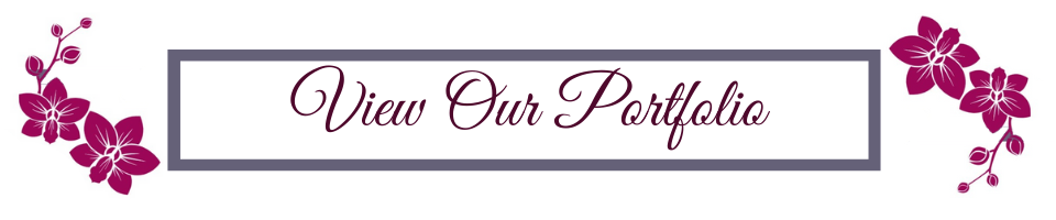 Decorative banner with purple flowers and script text reading “View Our Portfolio”