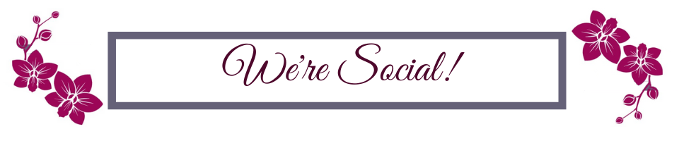 Floral-bordered sign reading “We’re Social!” in pink script on a white background.