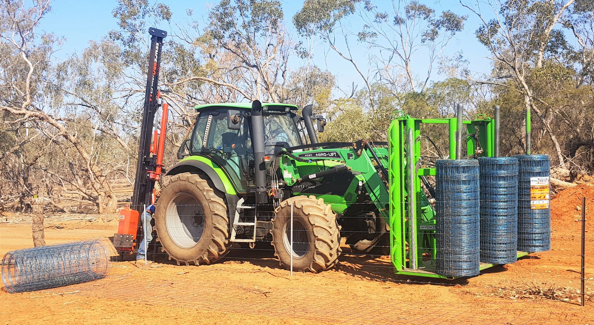 The FastFencer, carries 3 rolls of fencing mesh at once. Fencing machinery for hire-QuikFence